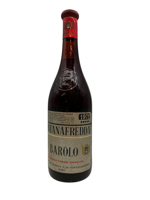 Bottle of Barolo Fontanafredda 1971 with red label and wine label in gold
