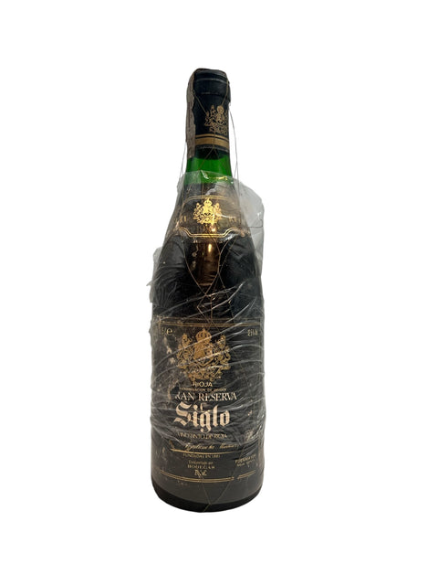 Flaska Gran Reserva Siglo 1982 inslagen i plast