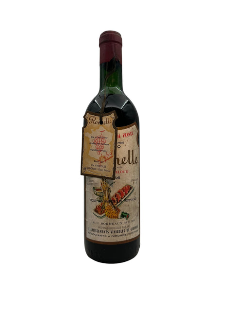 Antik flaske af Rochelle vin fra 1956 med etiketdetaljer