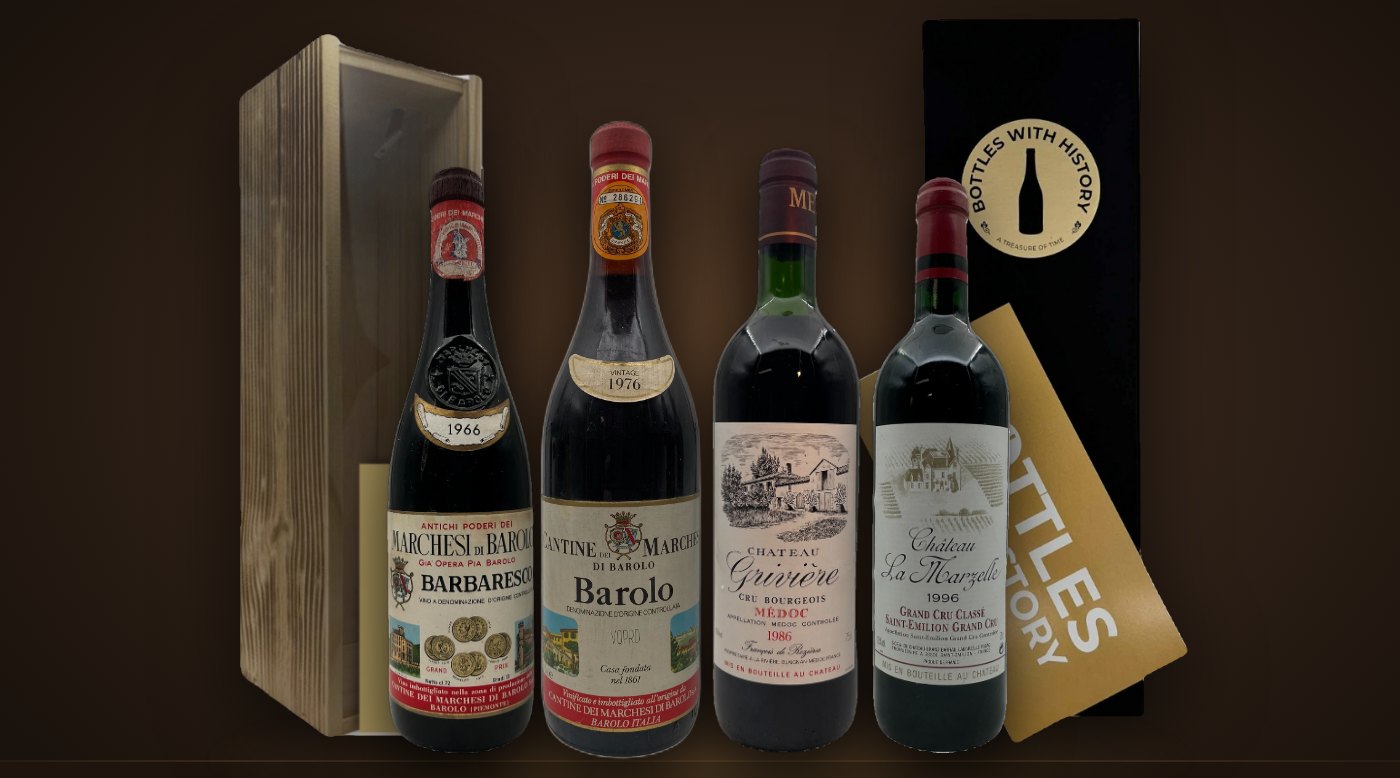 Årgångsviner från 1966, 1976, 1986 och 1996 framför Bottles With History-presentaskar i trä och svart